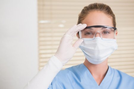 dentist-in-surgical-mask-and-protective-glasses-looking-at-camera_13339-171952.jpg
